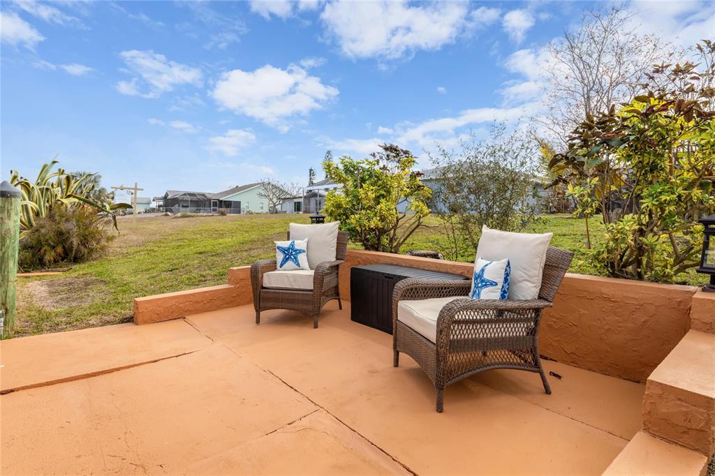 774 Spring Lake Boulevard Northwest Port Charlotte, FL 33952 - Photo 20 of 29 a view of a terrace with furniture