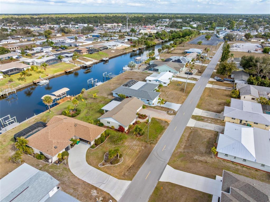 774 Spring Lake Boulevard Northwest Port Charlotte, FL 33952 - Photo 25 of 29 an aerial view of residential houses with outdoor space