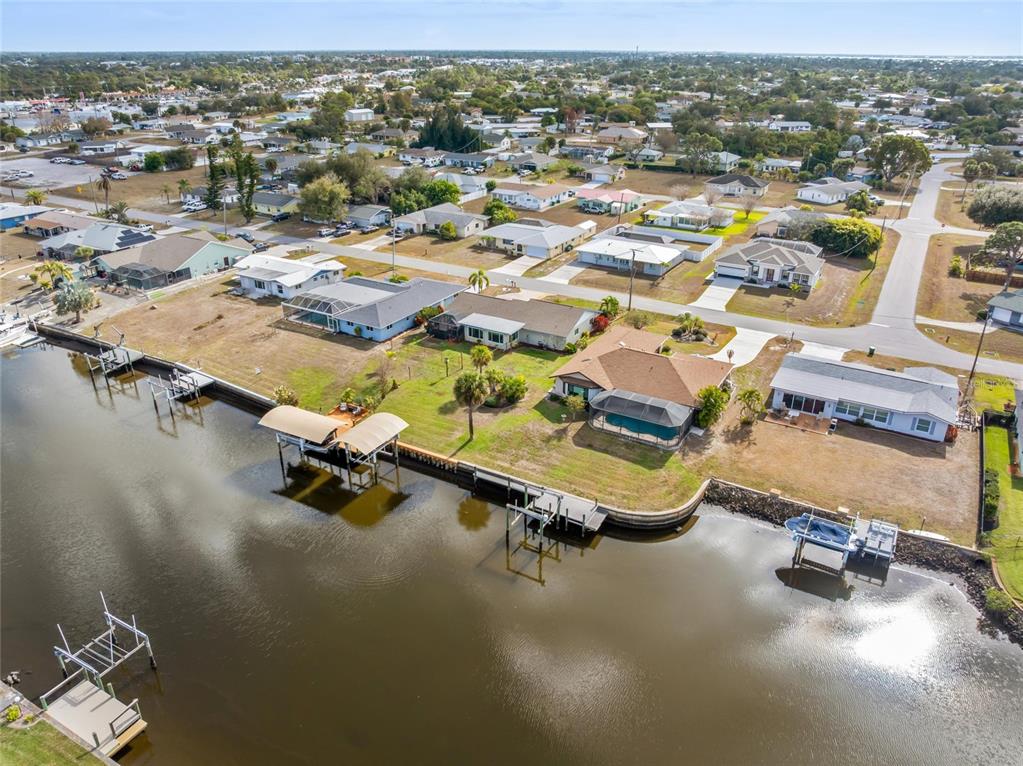774 Spring Lake Boulevard Northwest Port Charlotte, FL 33952 - Photo 26 of 29 an aerial view of a residential houses with outdoor space