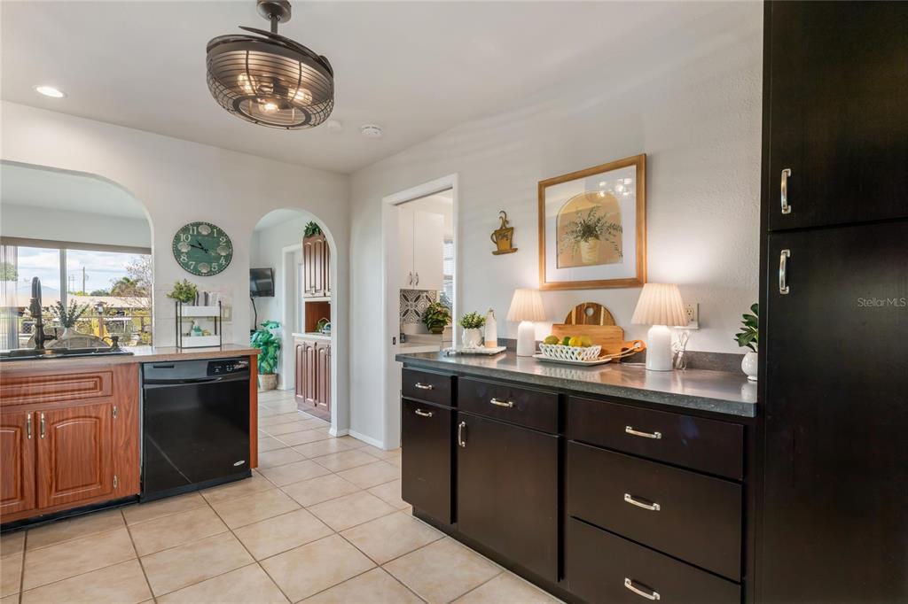 774 Spring Lake Boulevard Northwest Port Charlotte, FL 33952 - Photo 10 of 29 a view of a kitchen counter space and a window