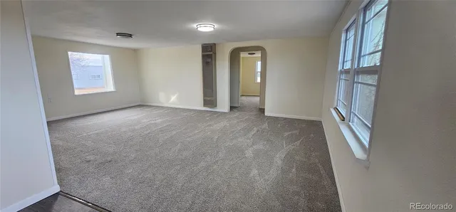 an empty room with windows