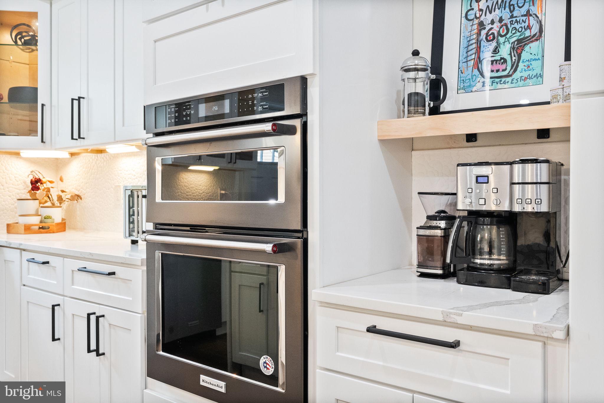 4625 4th Street Northwest Washington, DC 20011 - Photo 12 of 41 a kitchen with granite countertop cabinets stainless steel appliances and wooden floor