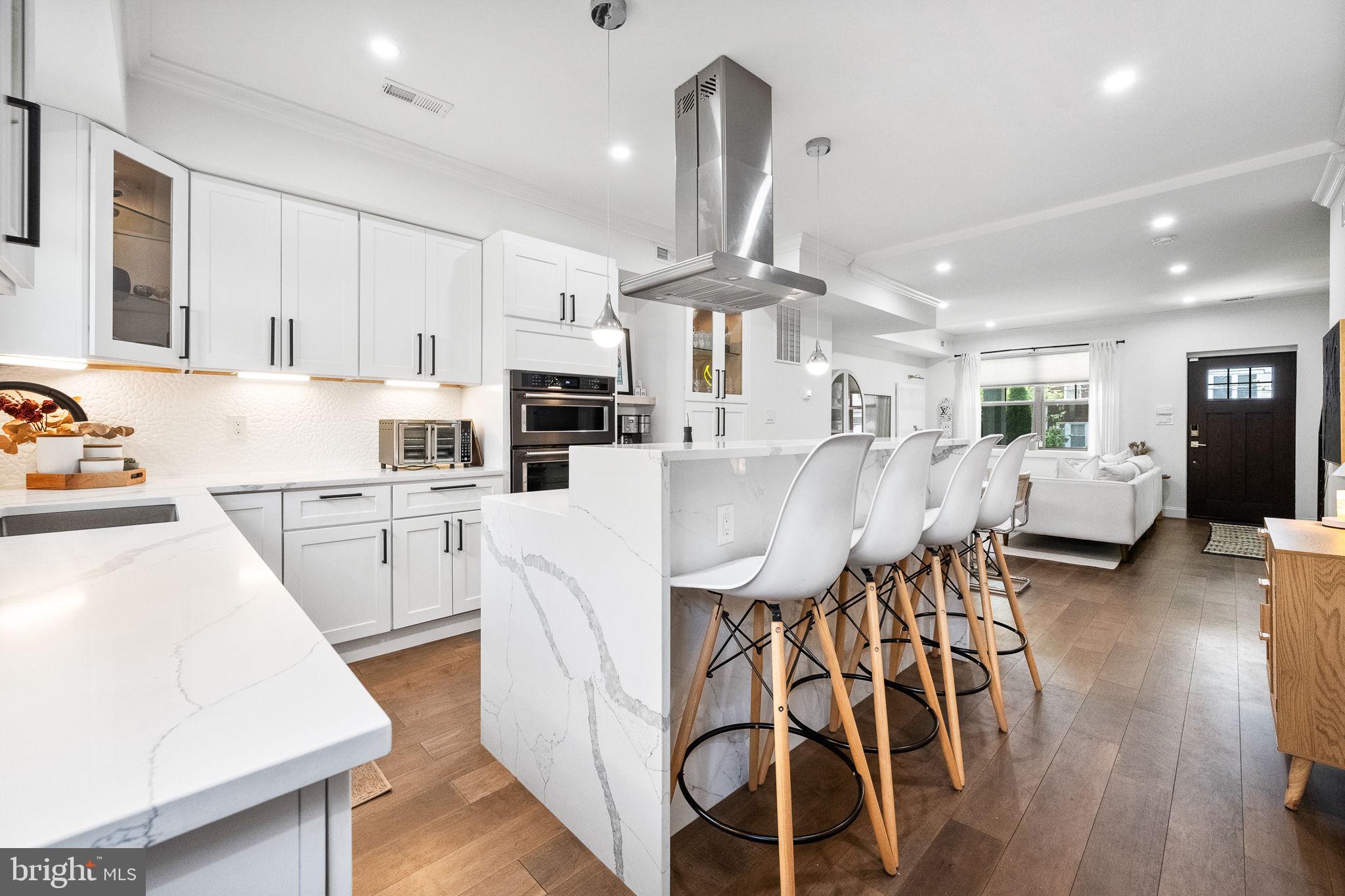 4625 4th Street Northwest Washington, DC 20011 - Photo 15 of 41 a kitchen with white cabinets and stainless steel appliances