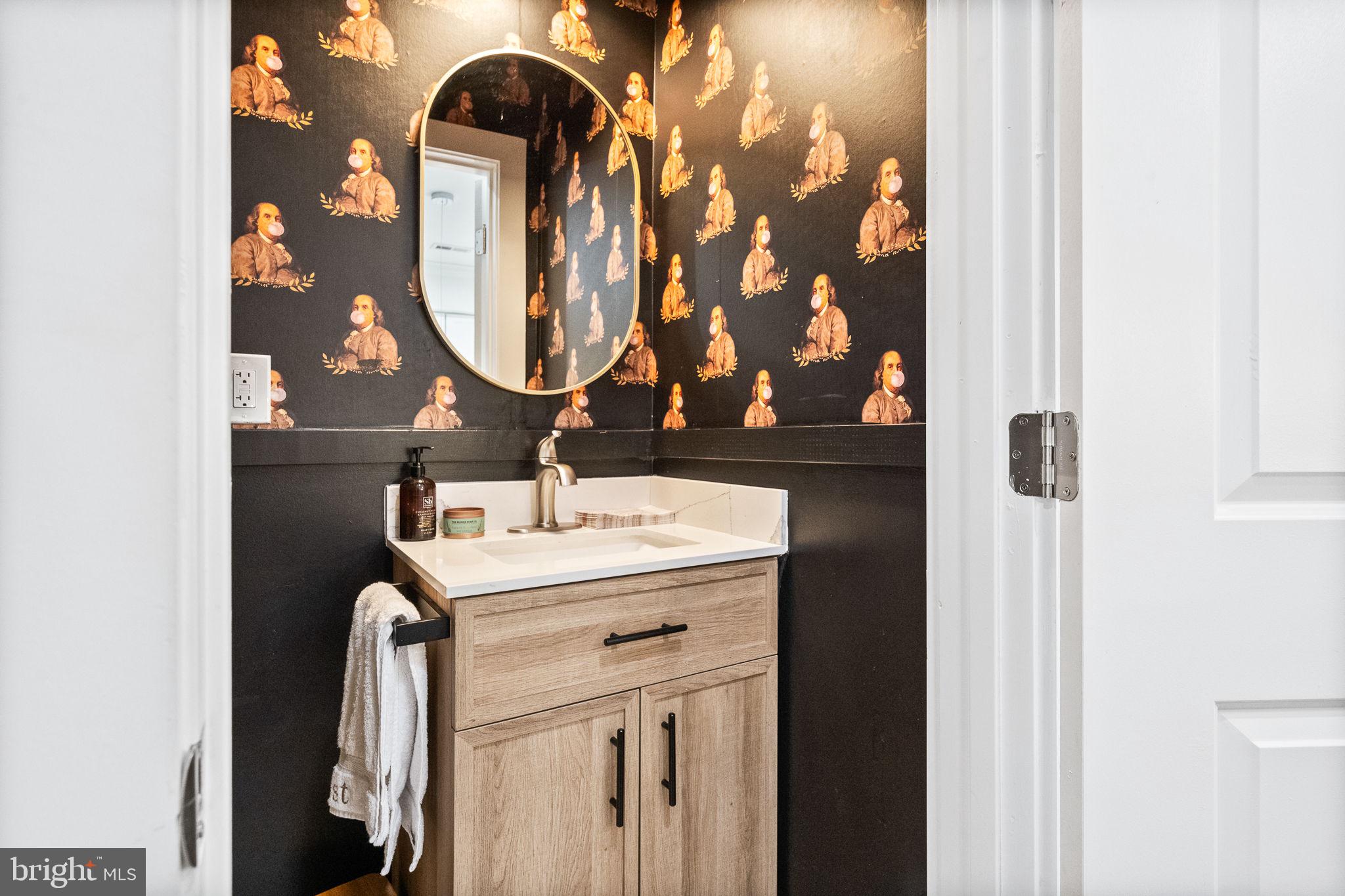 4625 4th Street Northwest Washington, DC 20011 - Photo 16 of 41 a bathroom with a sink and a mirror