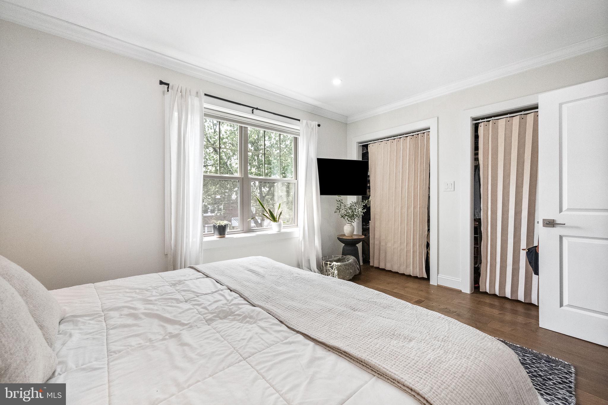 4625 4th Street Northwest Washington, DC 20011 - Photo 19 of 41 a bedroom with a bed and a window