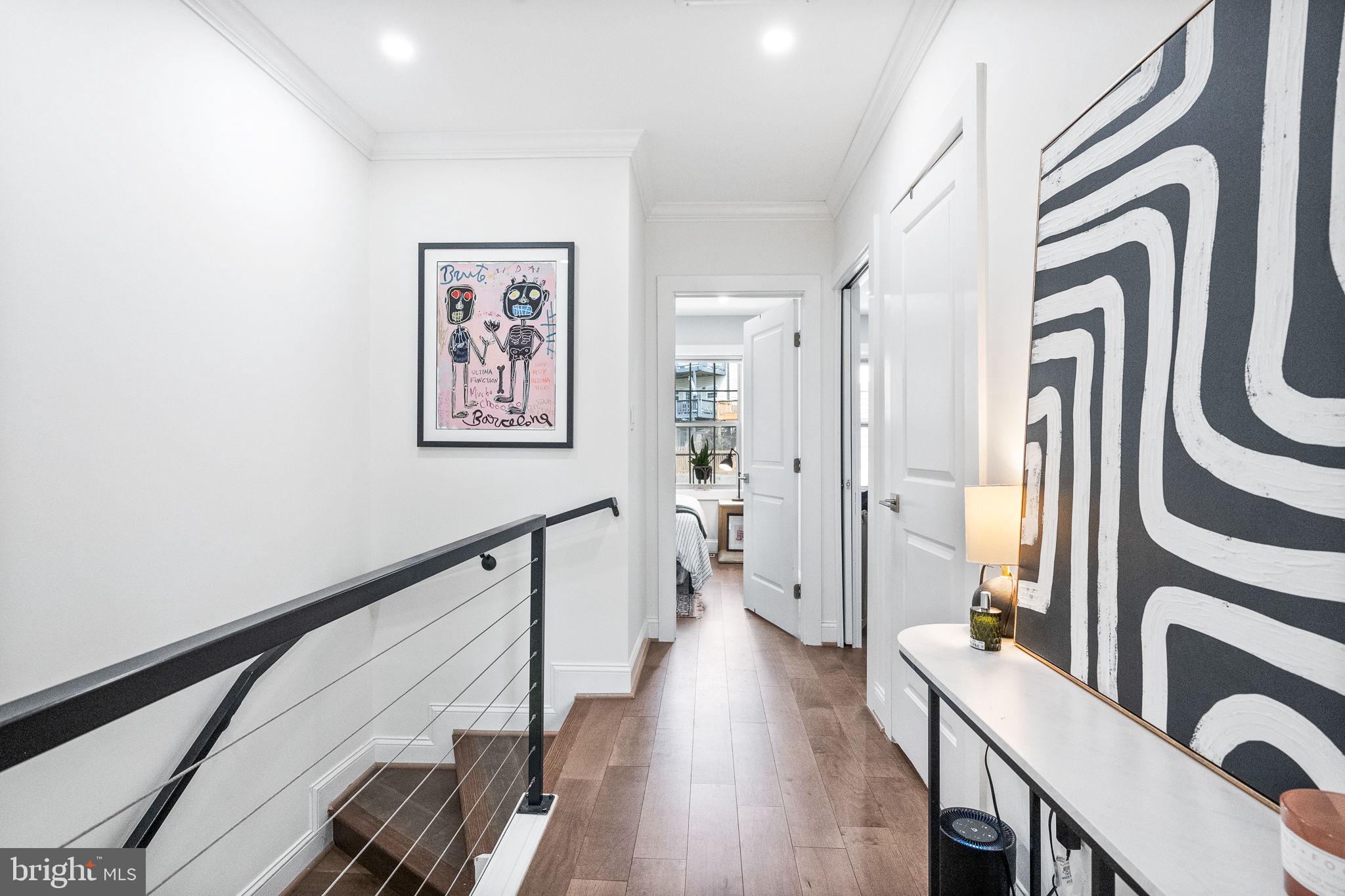 4625 4th Street Northwest Washington, DC 20011 - Photo 22 of 41 a view of a hallway with wooden floor and stairs