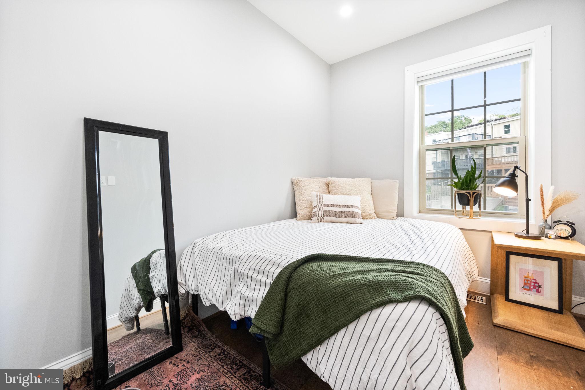 4625 4th Street Northwest Washington, DC 20011 - Photo 24 of 41 a bedroom with a bed and a window