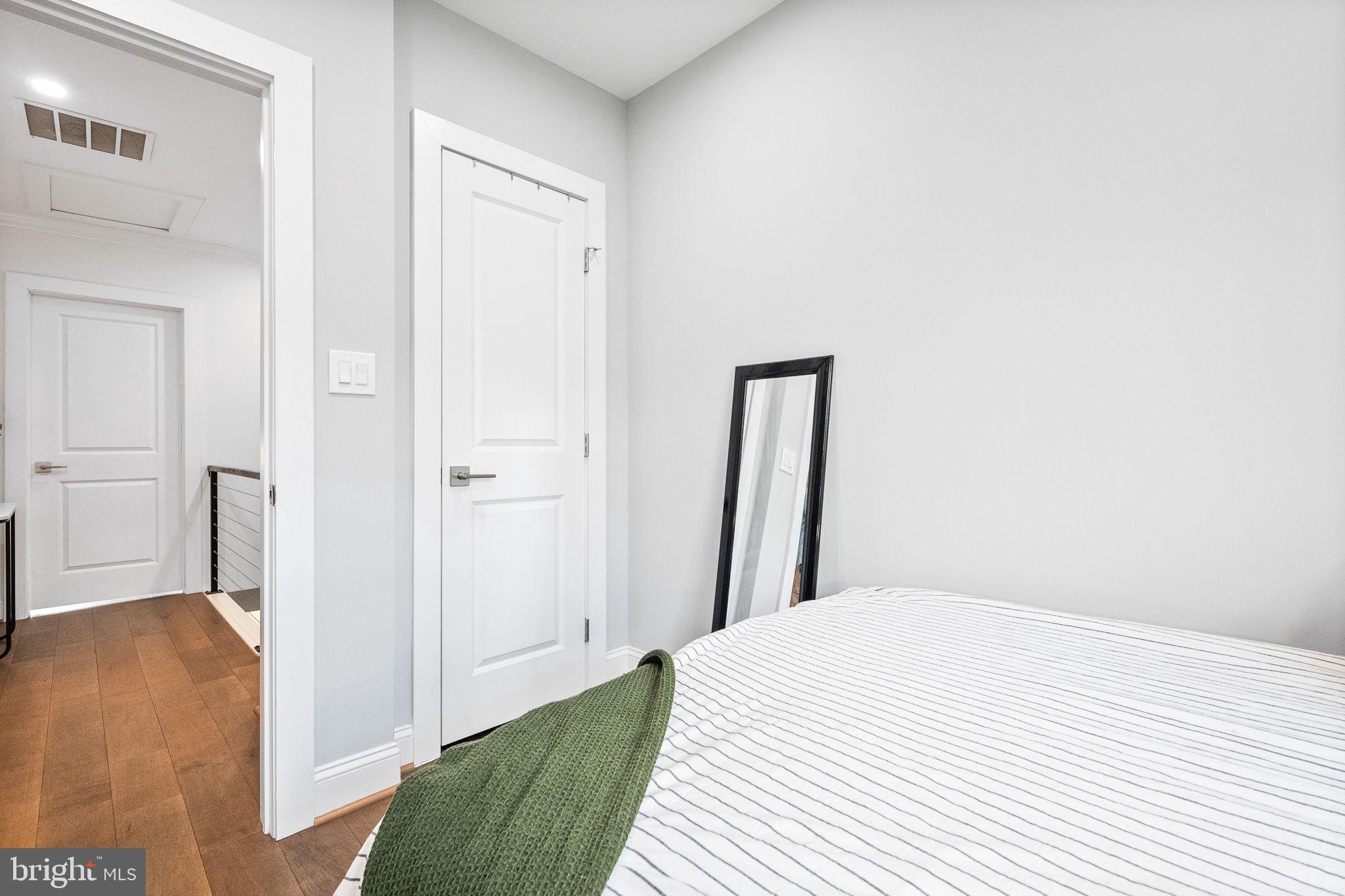 4625 4th Street Northwest Washington, DC 20011 - Photo 25 of 41 a bedroom with a bed and a rug