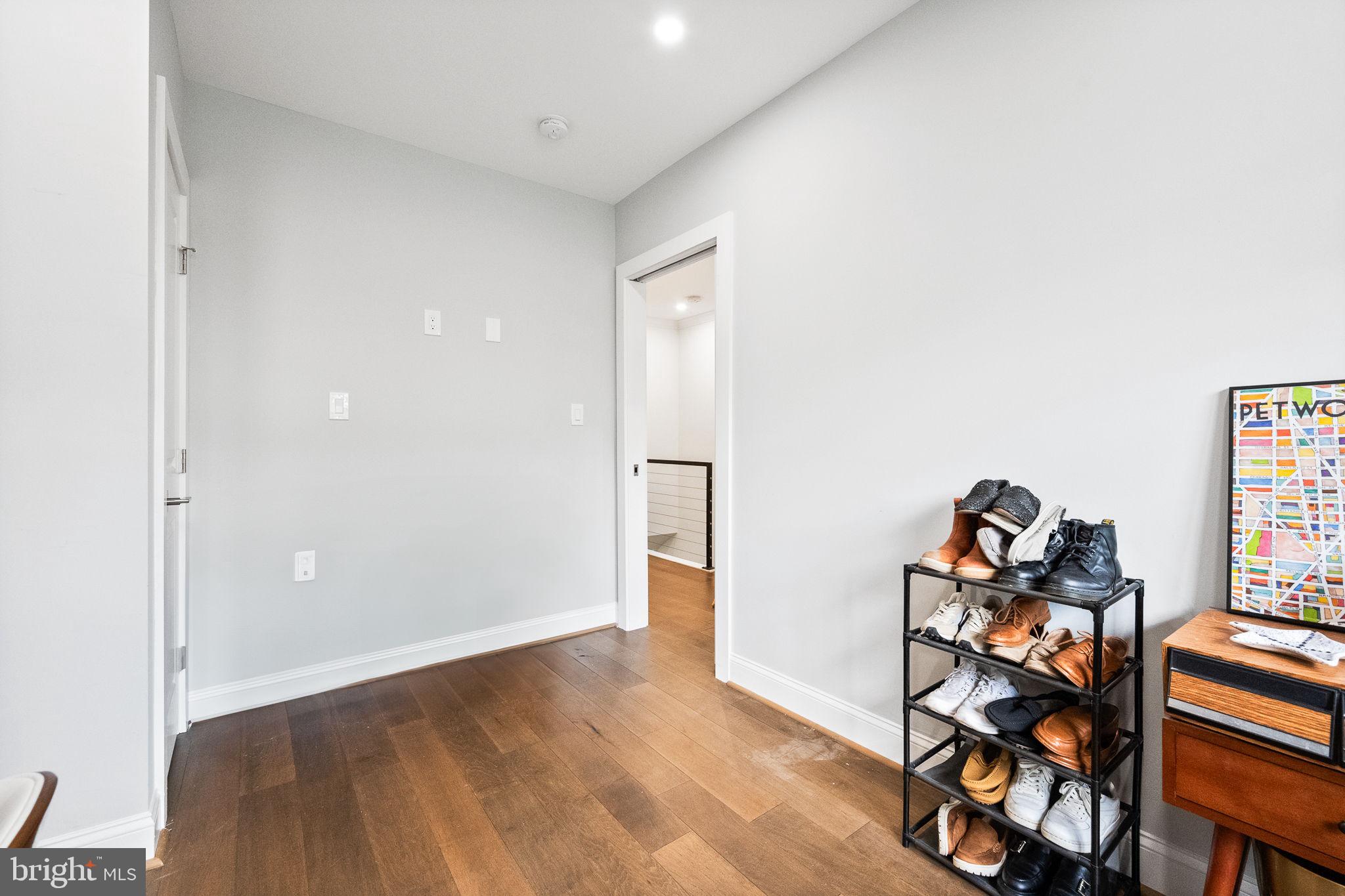 4625 4th Street Northwest Washington, DC 20011 - Photo 27 of 41 an empty room with wooden floor and cabinets