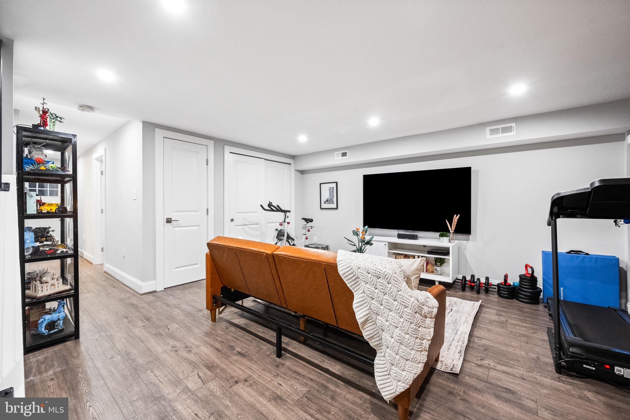 4625 4th Street Northwest Washington, DC 20011 - Photo 29 of 41 a living room with furniture and a flat screen tv