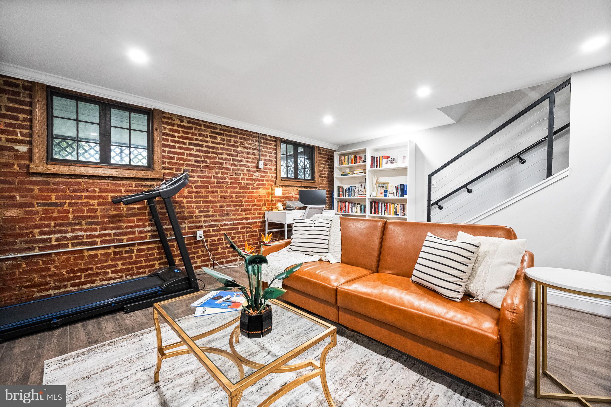 4625 4th Street Northwest Washington, DC 20011 - Photo 30 of 41 a couch sitting in a room next to a window
