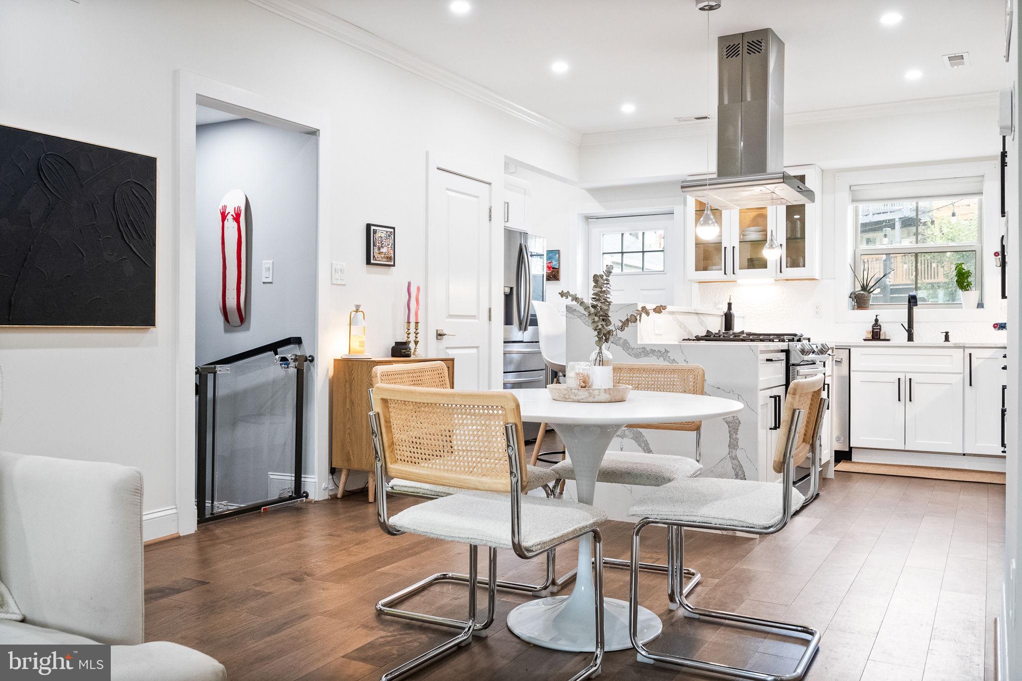 4625 4th Street Northwest Washington, DC 20011 - Photo 7 of 41 a view of kitchen with dining area refrigerator and wooden floor