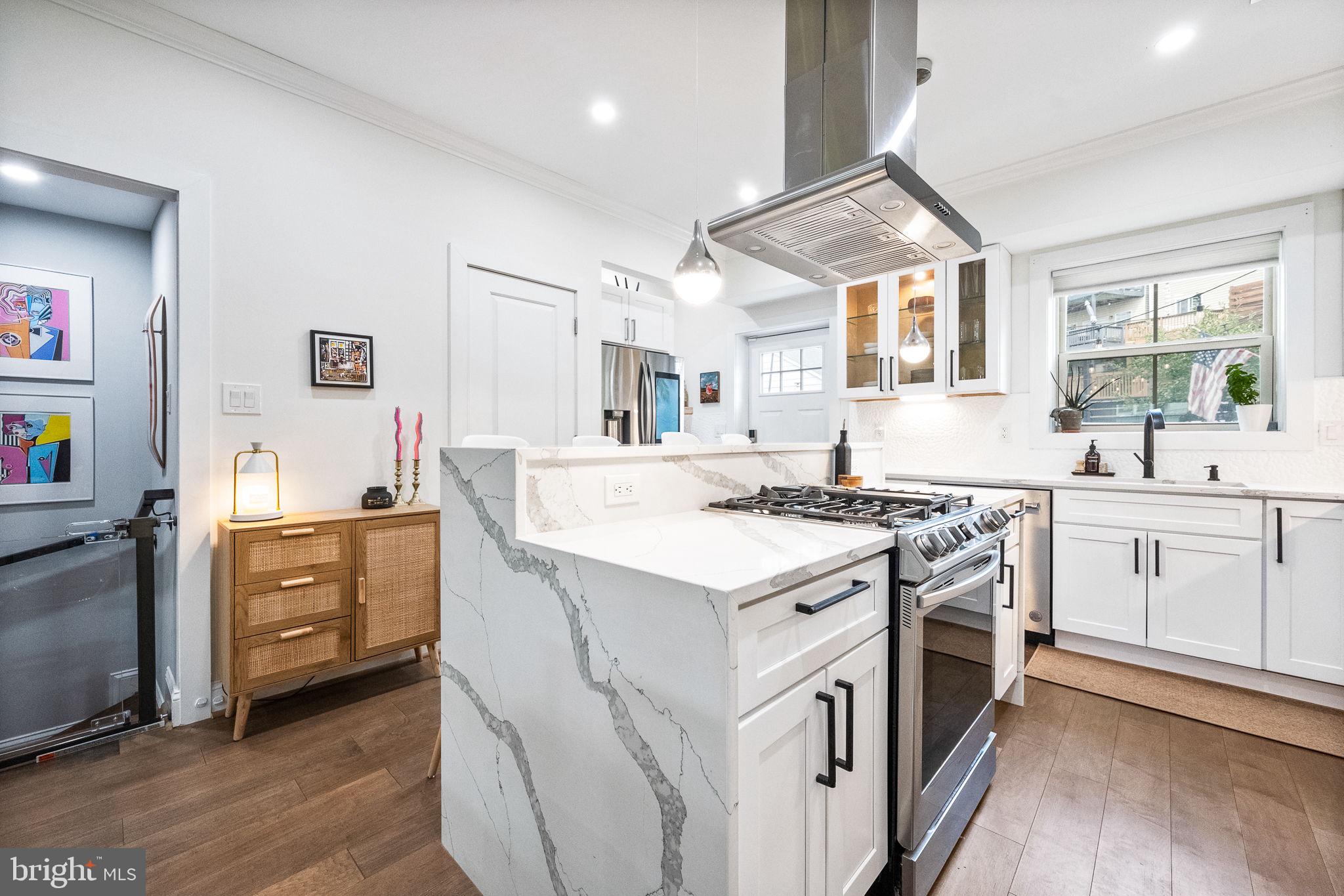4625 4th Street Northwest Washington, DC 20011 - Photo 10 of 41 a kitchen with white cabinets and white appliances