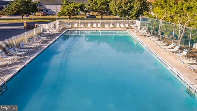 a view of swimming pool with a lake view