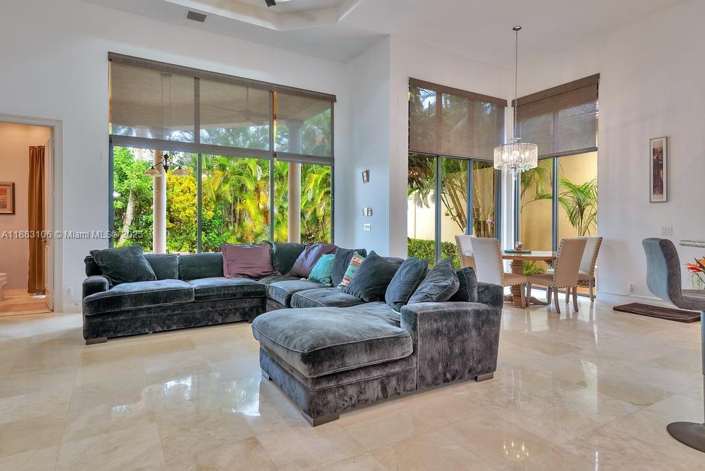 17931 Lake Azure Way Boca Raton, FL 33496 - Photo 12 of 59 a living room with furniture and a large window