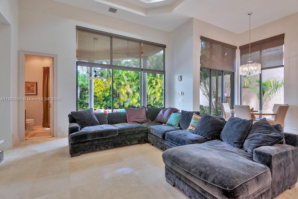 17931 Lake Azure Way Boca Raton, FL 33496 - Photo 13 of 59 a living room with furniture and a large window