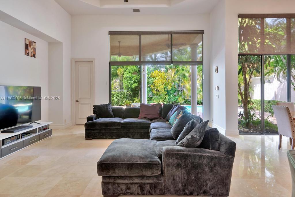 17931 Lake Azure Way Boca Raton, FL 33496 - Photo 14 of 59 a living room with furniture and a flat screen tv