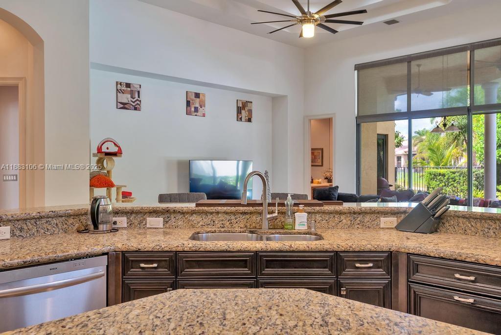 17931 Lake Azure Way Boca Raton, FL 33496 - Photo 16 of 59 a bathroom with a sink and a large mirror