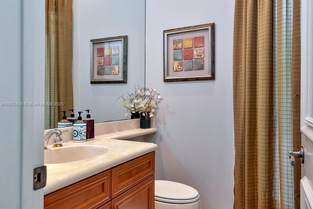 17931 Lake Azure Way Boca Raton, FL 33496 - Photo 20 of 59 a bathroom with a sink toilet and vanity