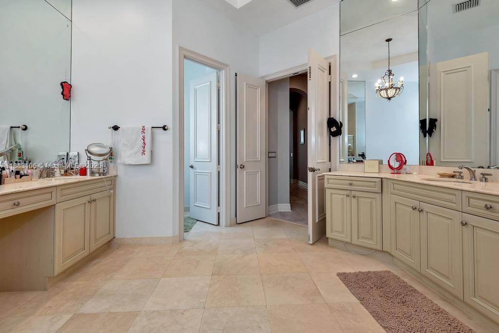 17931 Lake Azure Way Boca Raton, FL 33496 - Photo 26 of 59 a bathroom with a sink vanity tub and shower