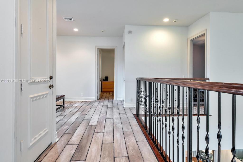 17931 Lake Azure Way Boca Raton, FL 33496 - Photo 30 of 59 a view of a hallway with wooden floor