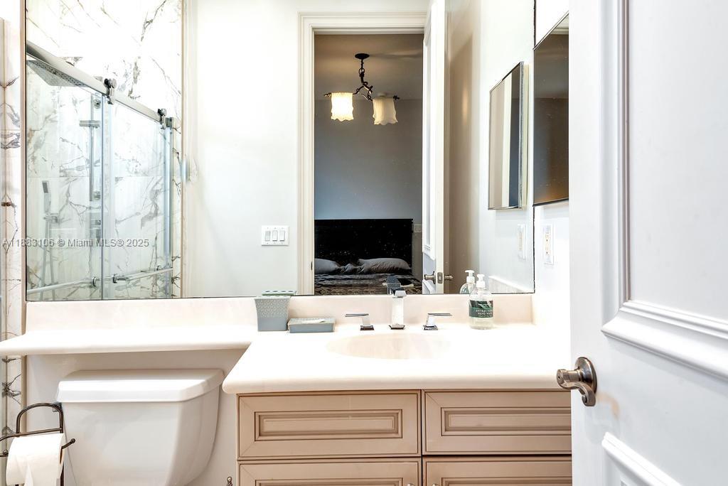 17931 Lake Azure Way Boca Raton, FL 33496 - Photo 34 of 59 a bathroom with a sink and a mirror