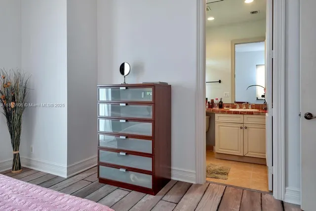 a living room with furniture a book shelf and a bookshelf