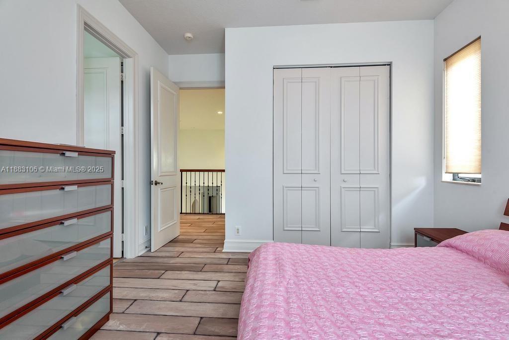 17931 Lake Azure Way Boca Raton, FL 33496 - Photo 45 of 59 a bedroom with a bed and a mirror