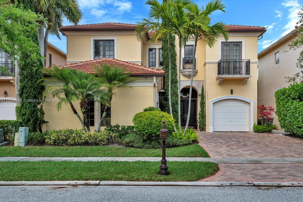 17931 Lake Azure Way Boca Raton, FL 33496 - Photo 58 of 59 a front view of a house with garden