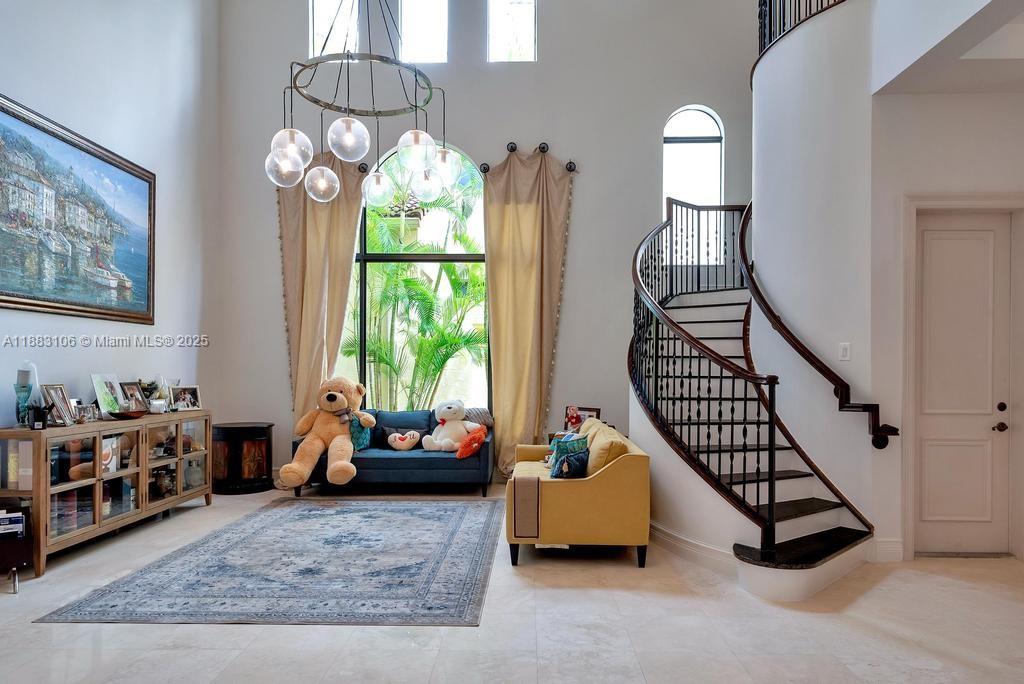 17931 Lake Azure Way Boca Raton, FL 33496 - Photo 7 of 59 a bedroom with furniture and a large window