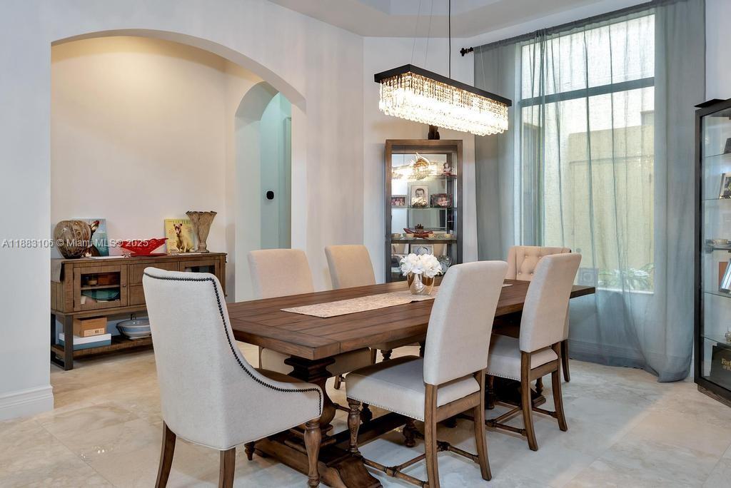 17931 Lake Azure Way Boca Raton, FL 33496 - Photo 10 of 59 a view of a dining room with furniture and a window