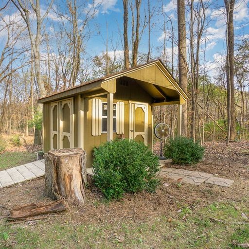 816 High Point Ridge Road Franklin, TN 37069 - Photo 8 of 40 a front view of a house with yard and glass windows