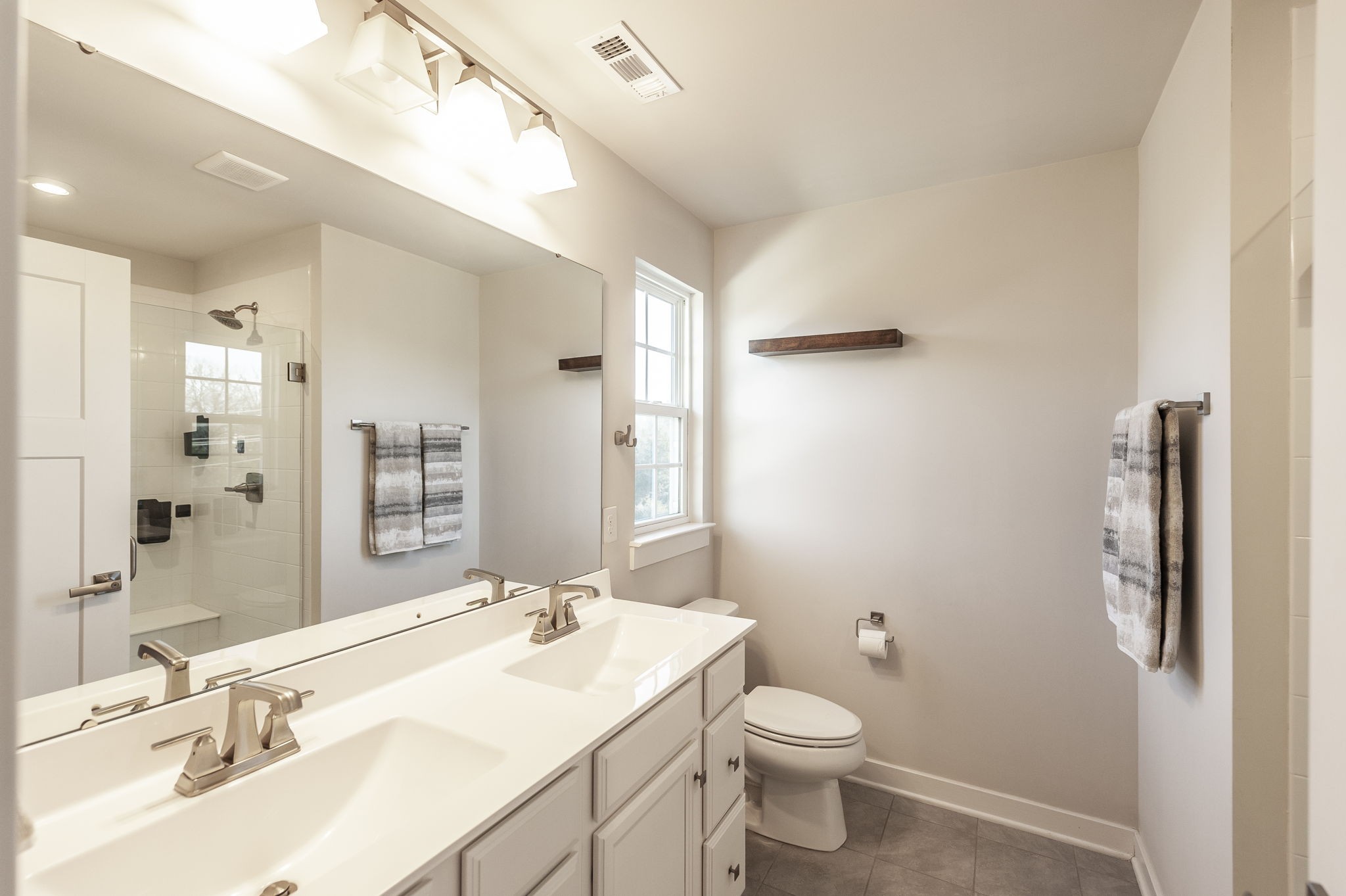 86 French Street Goodlettsville, TN 37072 - Photo 15 of 32 a bathroom with a granite countertop sink toilet and shower