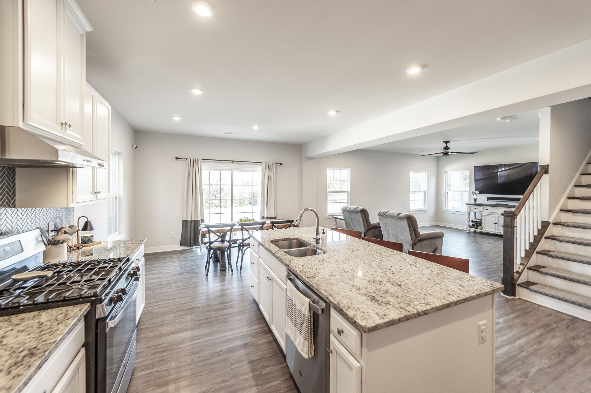 86 French Street Goodlettsville, TN 37072 - Photo 6 of 32 a kitchen with stainless steel appliances granite countertop table chairs and a stove