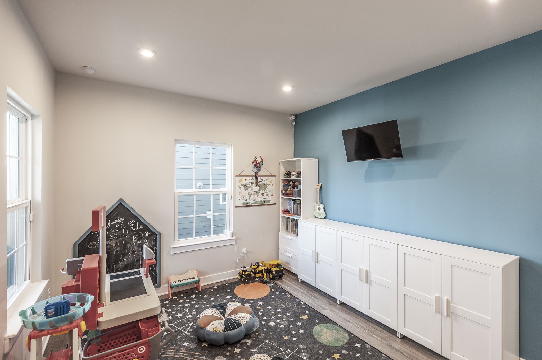 86 French Street Goodlettsville, TN 37072 - Photo 9 of 32 a living room with furniture and a flat screen tv