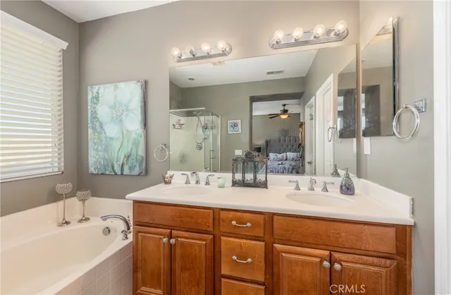 a bathroom with a double vanity sink mirror and double