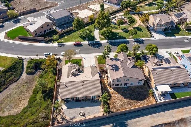 an aerial view of a house with a garden and plants