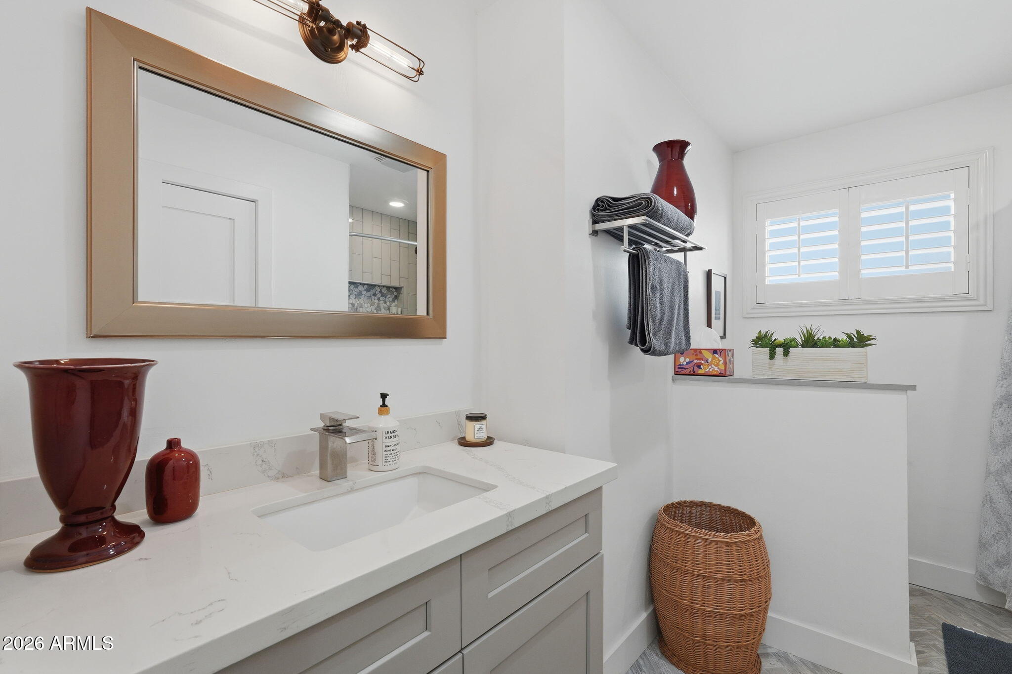 5149 North 34th Street Phoenix, AZ 85018 - Photo 47 of 70 a bathroom with a sink and a mirror