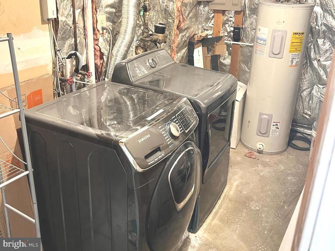13965 Palmer House Way, Unit 27195 Silver Spring, MD 20904 - Photo 15 of 16 a utility room with dryer and washer