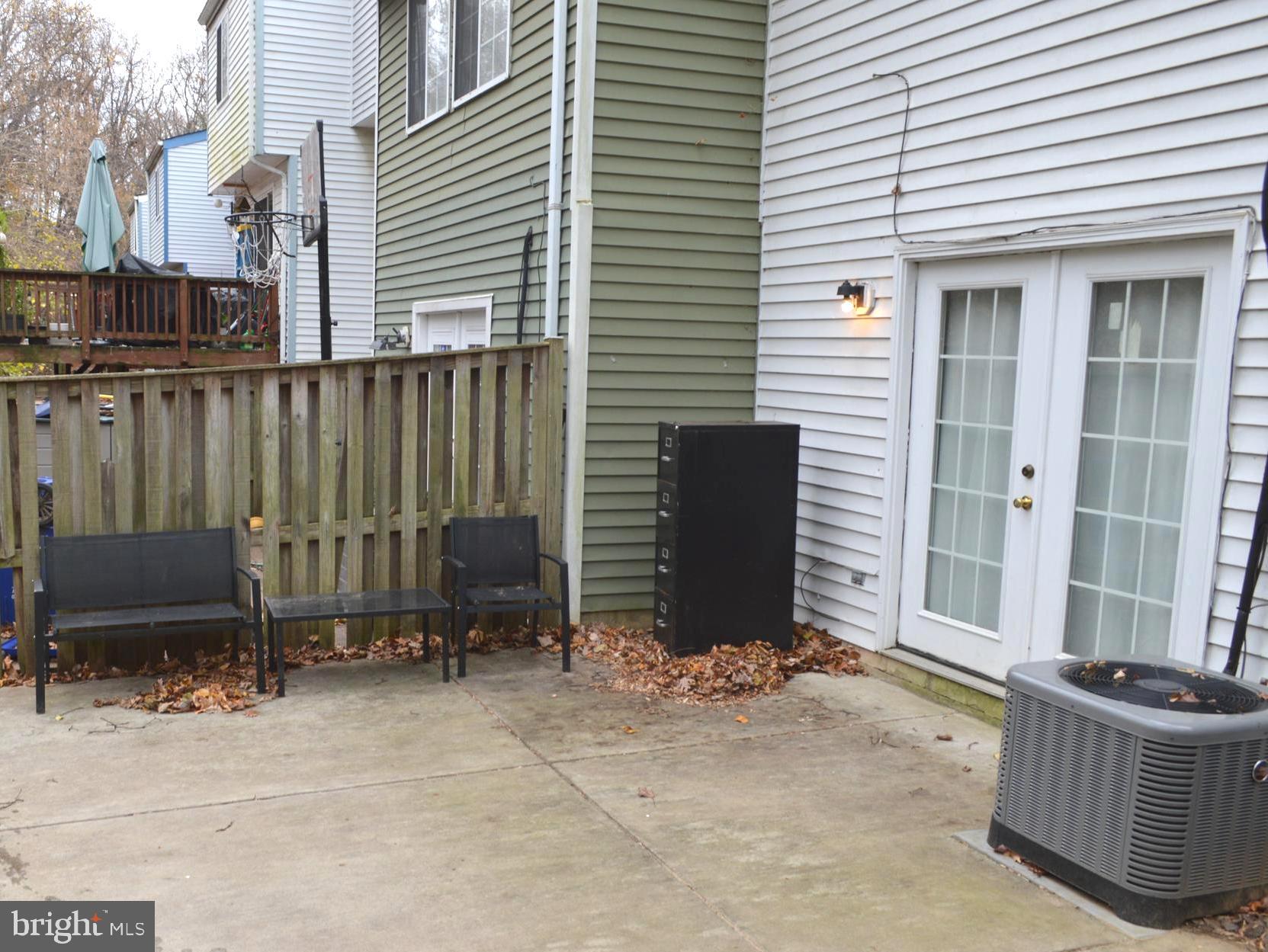 13965 Palmer House Way, Unit 27195 Silver Spring, MD 20904 - Photo 16 of 16 a view of a house with backyard and sitting area