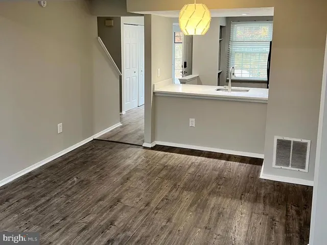 a view of a kitchen from the hallway