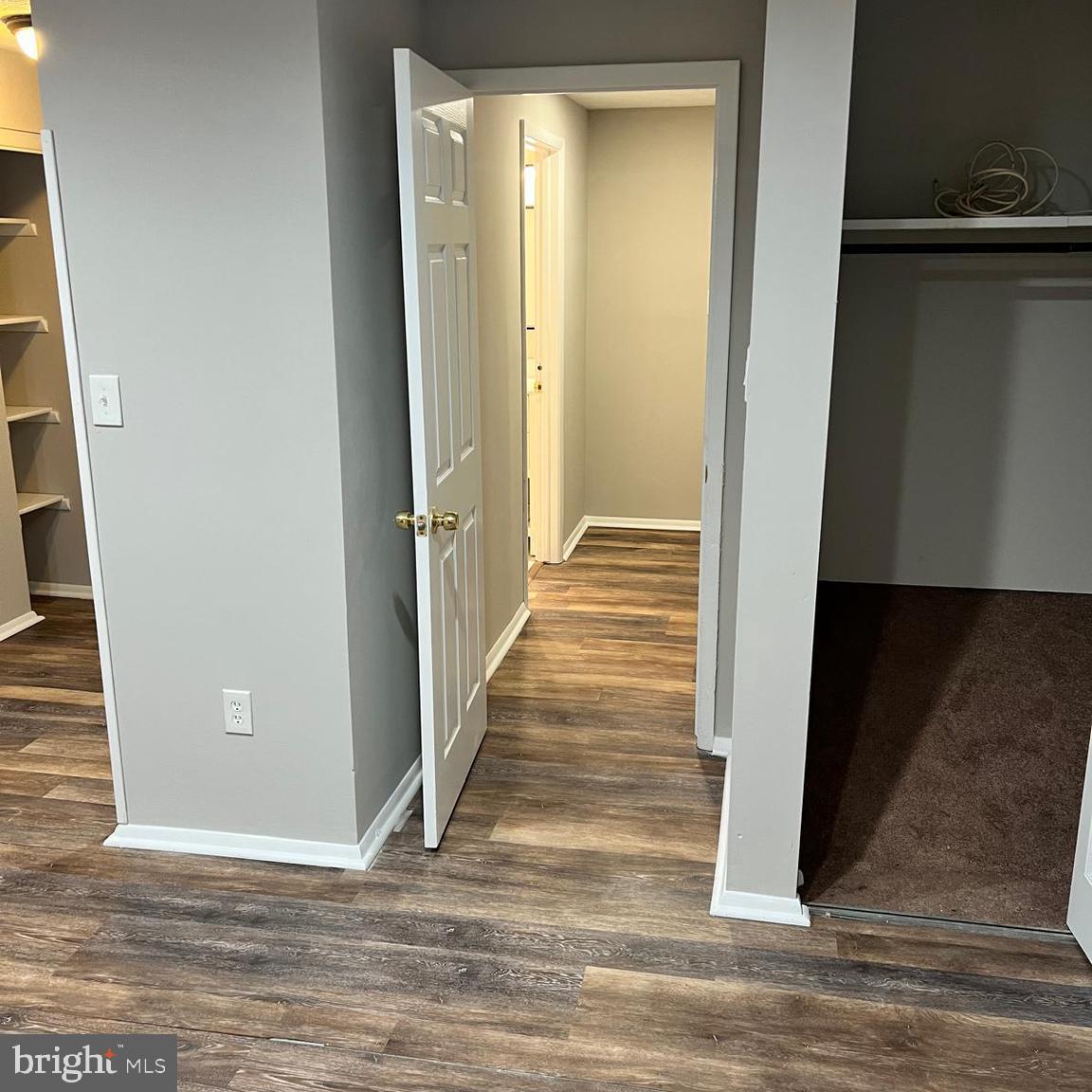 13965 Palmer House Way, Unit 27195 Silver Spring, MD 20904 - Photo 8 of 16 a view of a hallway with wooden floor and staircase