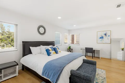 a bedroom with bed and window