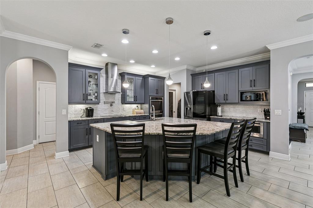 2541 Red Berry Way Ocoee, FL 34761 - Photo 12 of 49 a kitchen with a table and chairs in it