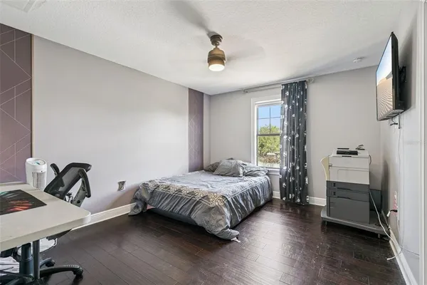 a bedroom with furniture and a fireplace