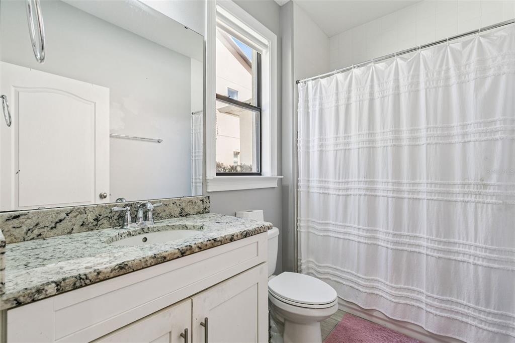 2541 Red Berry Way Ocoee, FL 34761 - Photo 27 of 49 a bathroom with a granite countertop sink and a mirror