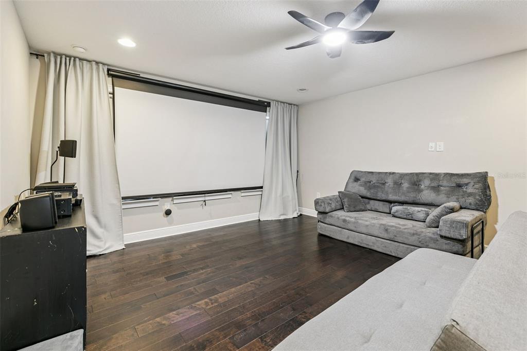 2541 Red Berry Way Ocoee, FL 34761 - Photo 29 of 49 a living room with furniture and a flat screen tv