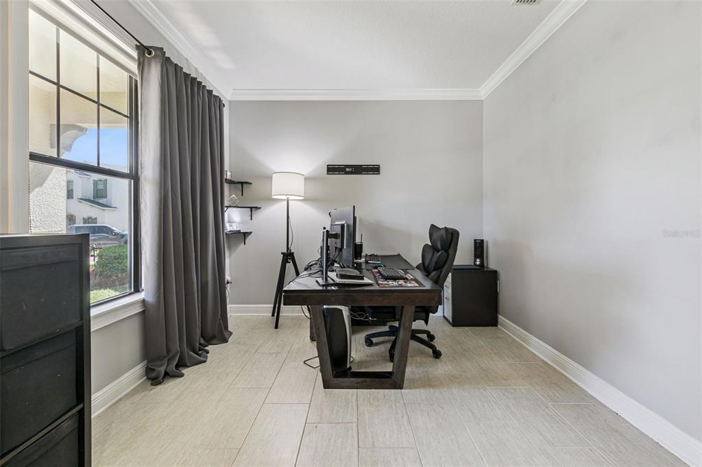 2541 Red Berry Way Ocoee, FL 34761 - Photo 30 of 49 a view of a workspace with furniture and a window