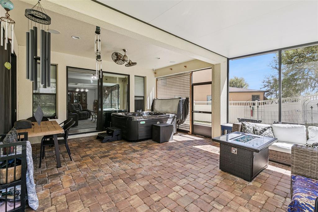 2541 Red Berry Way Ocoee, FL 34761 - Photo 32 of 49 a living room with furniture a large window and a fireplace