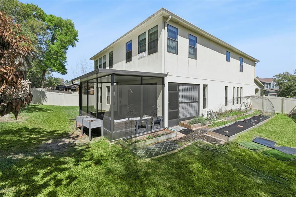 2541 Red Berry Way Ocoee, FL 34761 - Photo 33 of 49 a house view with a garden space